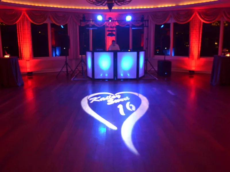 Custom gobo monogram projected onto a wall as a projection display at an event